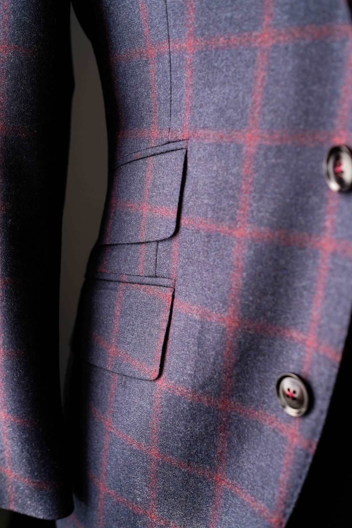 Close up of a windowpane check jacket pocket